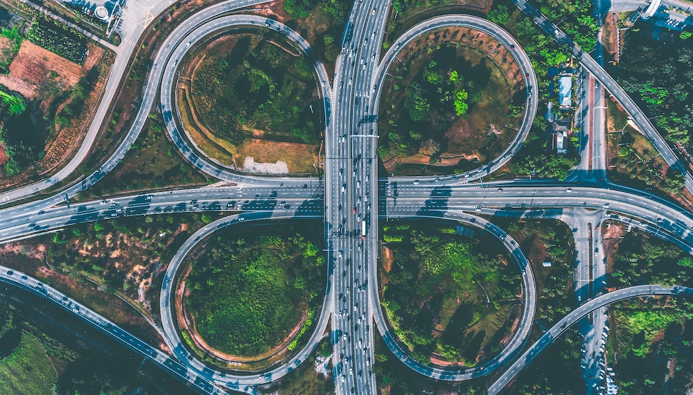 Aerial view of a highway interchange with looping ramps
